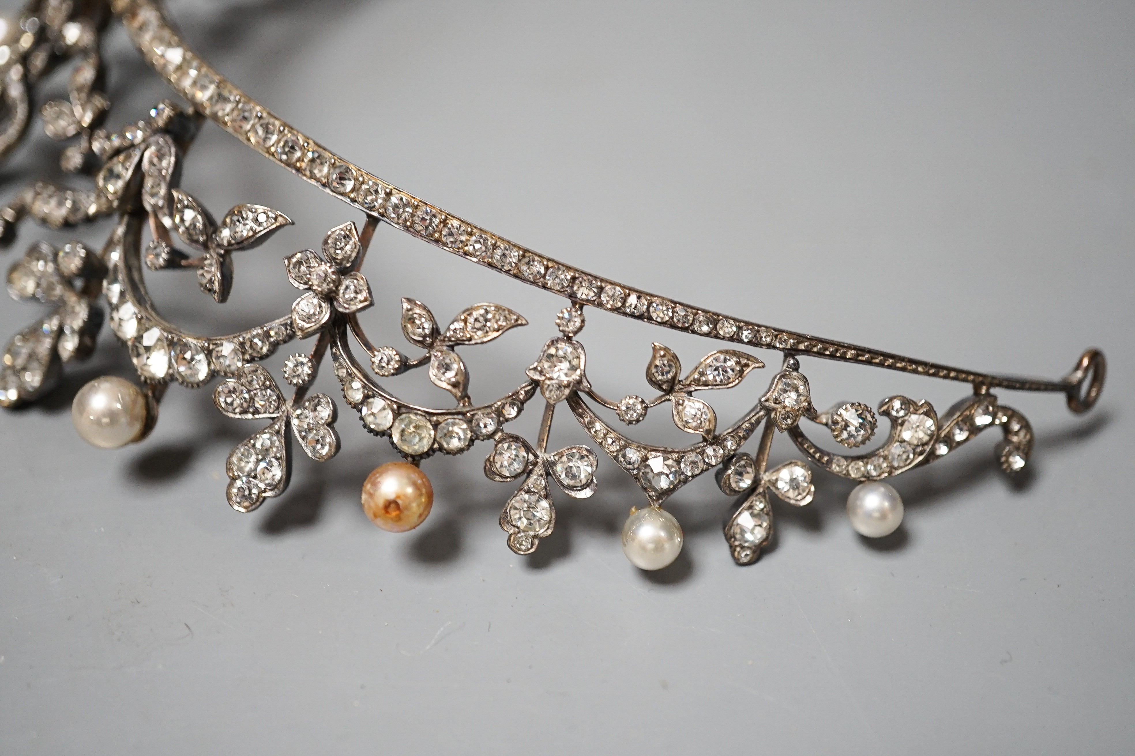 An Edwardian white metal and paste set tiara, 13cm.